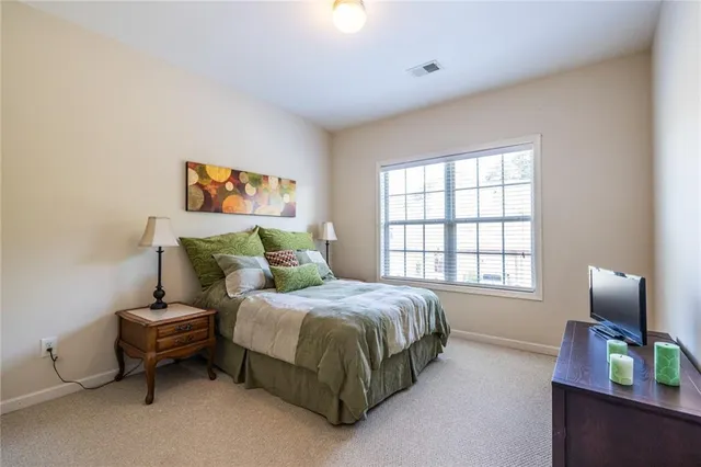 a bedroom with a bed and window