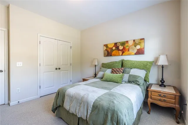 a bedroom with a bed and a couch