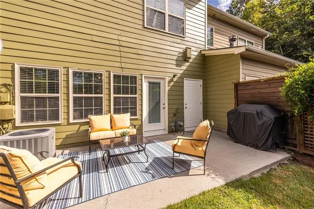 a view of a patio with a table and chairs
