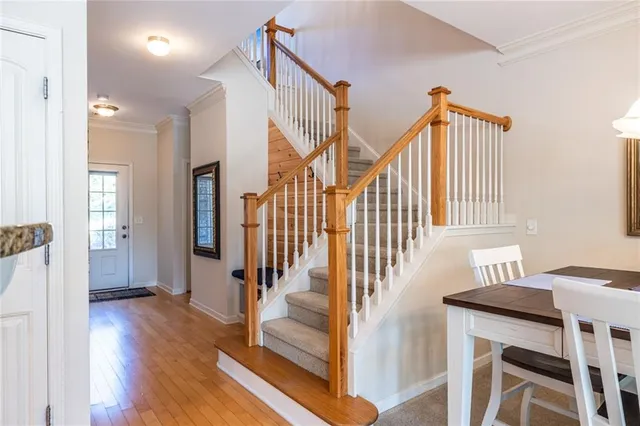 a view of an entryway with wooden floor and windows