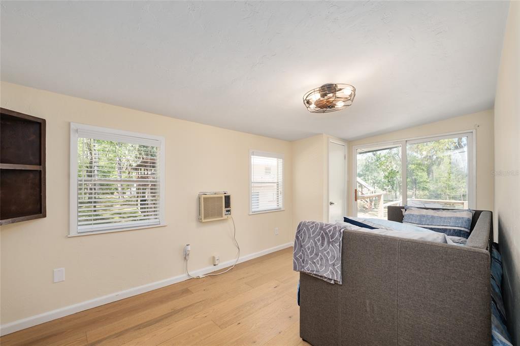 7870 Southwest 25th Place Bell, FL 32619 - Photo 78 of 99 a living room with furniture and a window