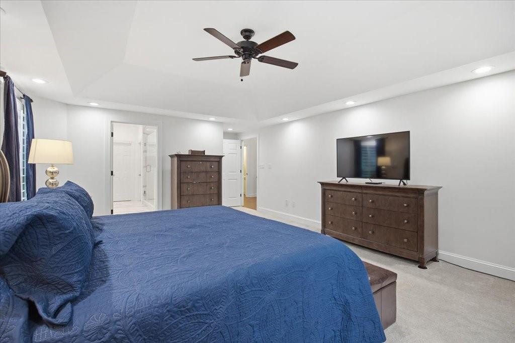 397 Thomas Road Dallas, GA 30132 - Photo 35 of 108 a bedroom with a bed and a television on desk