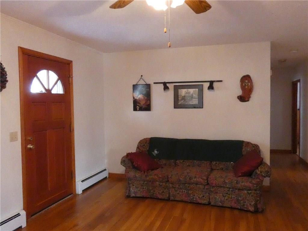 7 Highland Road Jay, ME 04239 - Photo 9 of 27 Spacious living room with hardwood...