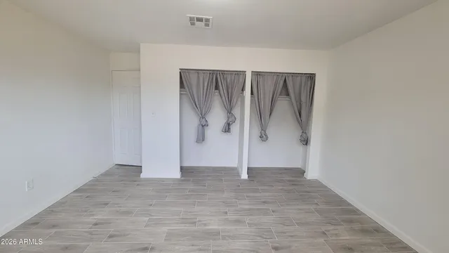 a white toilet sitting next to a bathroom sink