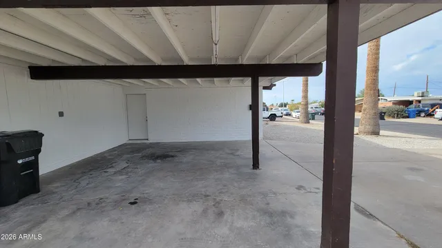 a kitchen with granite countertop a stove a sink and a microwave