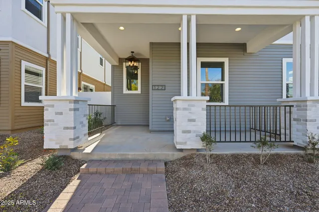 a view of a brick house with many windows