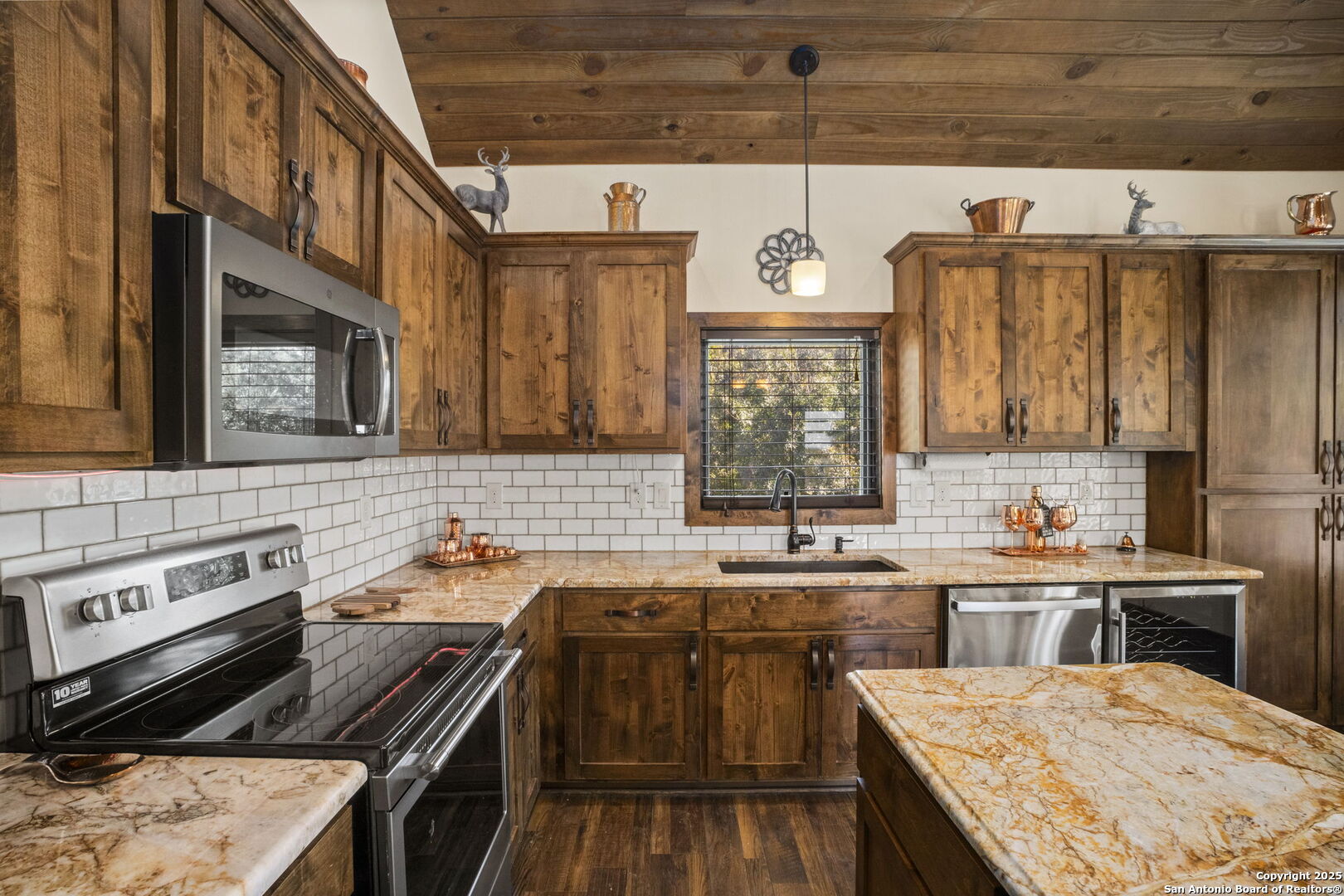 3615 Riverside Drive Kerrville, TX 78028 - Photo 18 of 50 a kitchen with a sink stove and cabinets