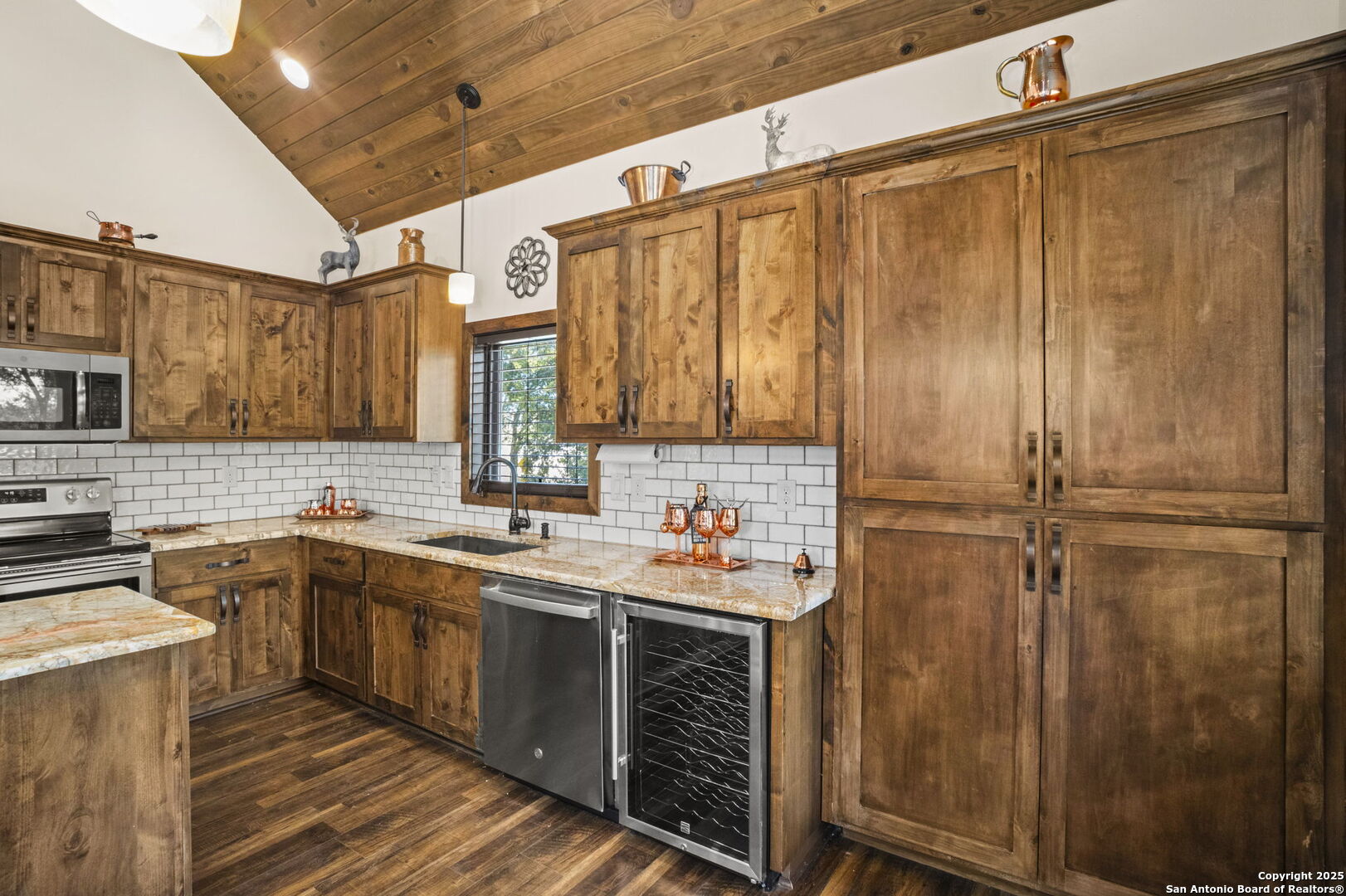 3615 Riverside Drive Kerrville, TX 78028 - Photo 19 of 50 a kitchen with a sink cabinets stainless steel appliances and a counter top space