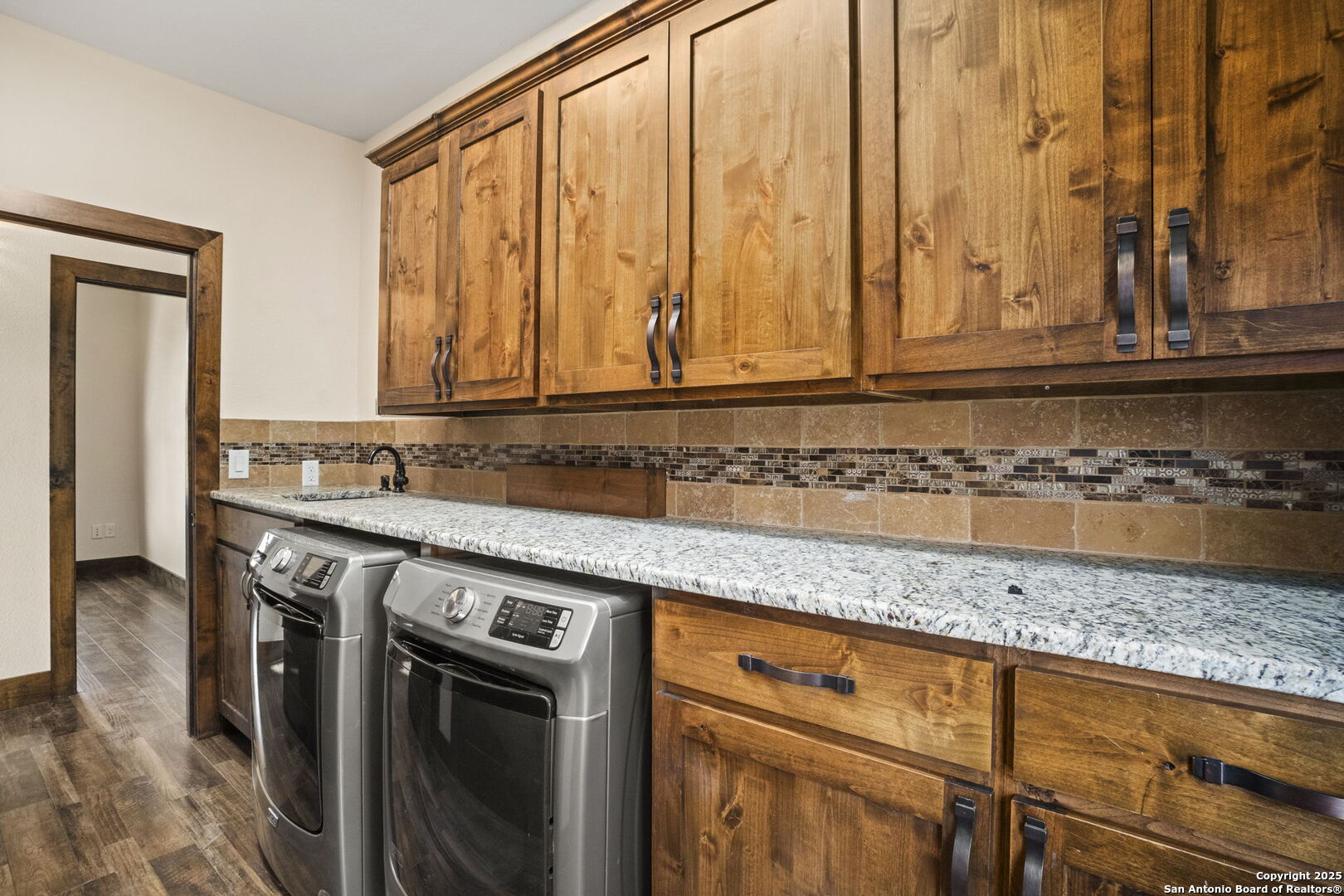 3615 Riverside Drive Kerrville, TX 78028 - Photo 20 of 50 a view of a kitchen with granite countertop cabinets and a sink
