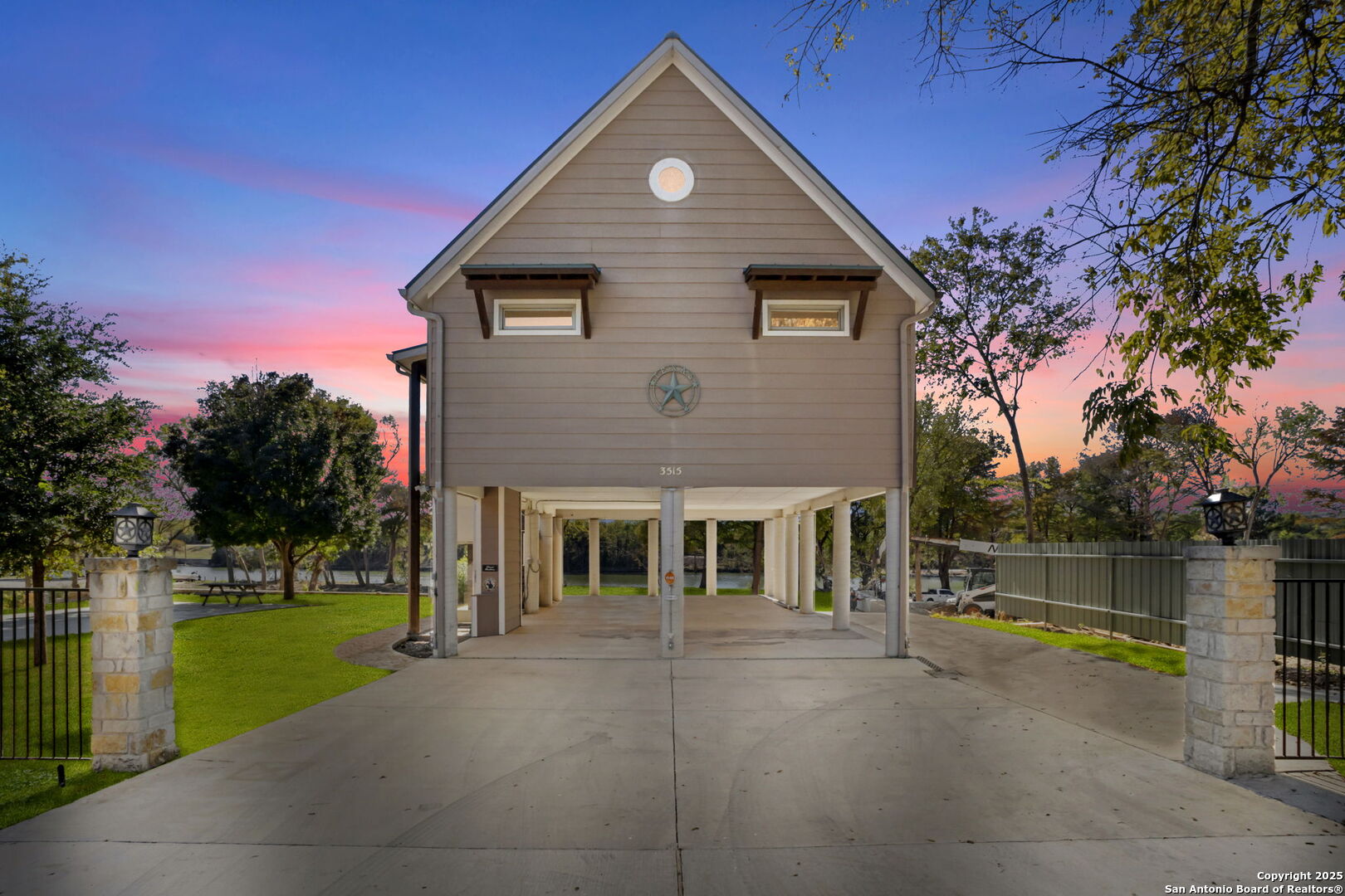 3615 Riverside Drive Kerrville, TX 78028 - Photo 2 of 50 a front view of a house with a yard