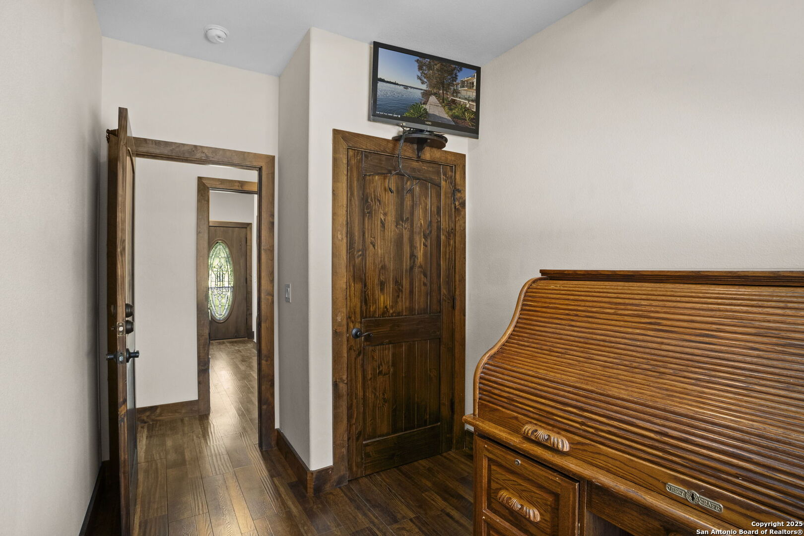 3615 Riverside Drive Kerrville, TX 78028 - Photo 22 of 50 a view of a hallway with wooden floor and closet