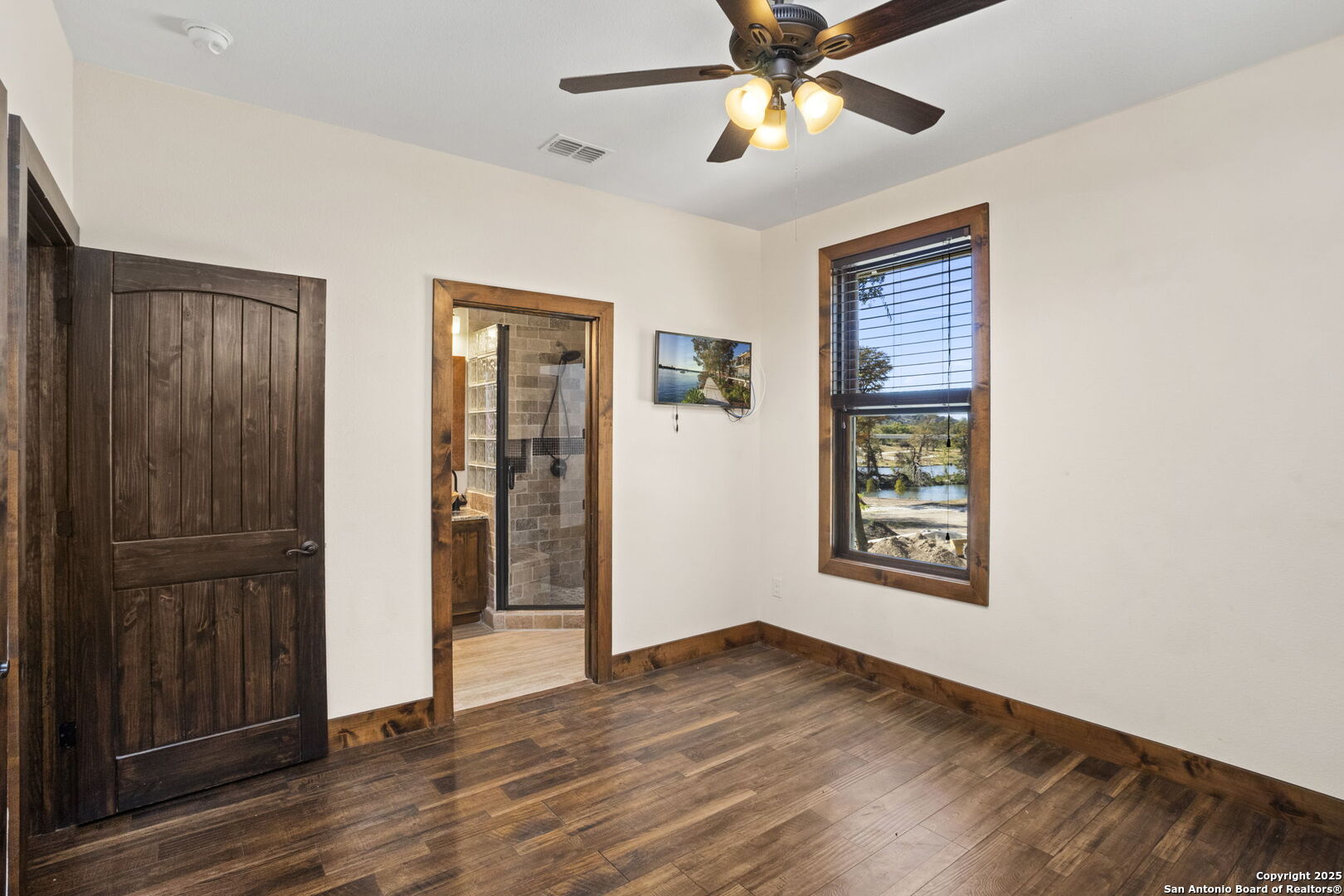 3615 Riverside Drive Kerrville, TX 78028 - Photo 24 of 50 wooden floor in an empty room with a window