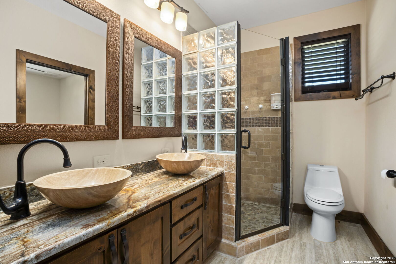3615 Riverside Drive Kerrville, TX 78028 - Photo 25 of 50 a bathroom with a granite countertop sink toilet and shower