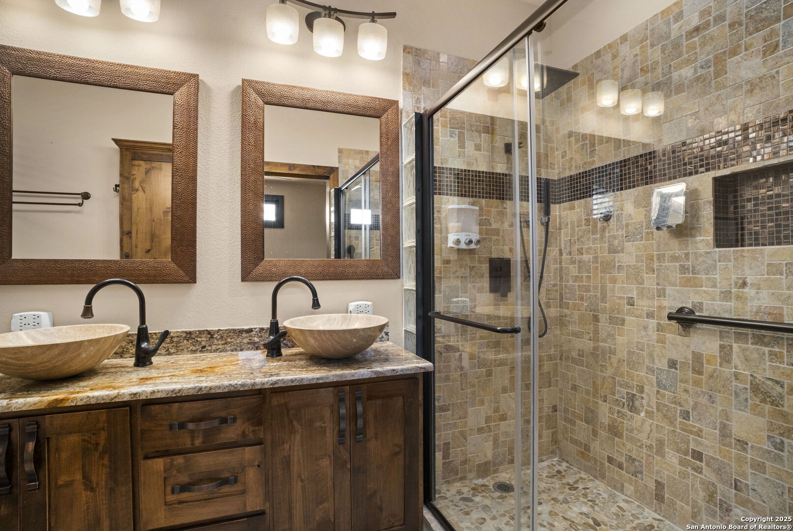 3615 Riverside Drive Kerrville, TX 78028 - Photo 27 of 50 a bathroom with a granite countertop sink a mirror and shower