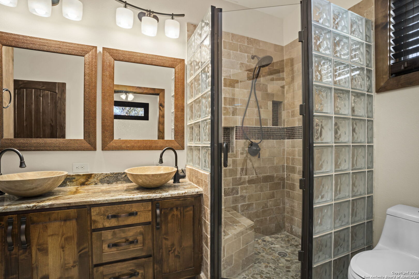 3615 Riverside Drive Kerrville, TX 78028 - Photo 30 of 50 a bathroom with a granite countertop sink toilet and shower