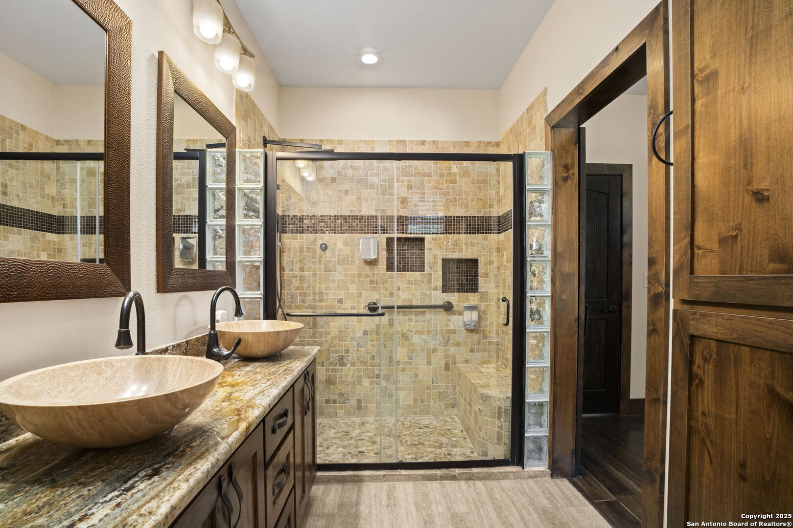 3615 Riverside Drive Kerrville, TX 78028 - Photo 34 of 50 a kitchen with granite countertop a sink and a refrigerator