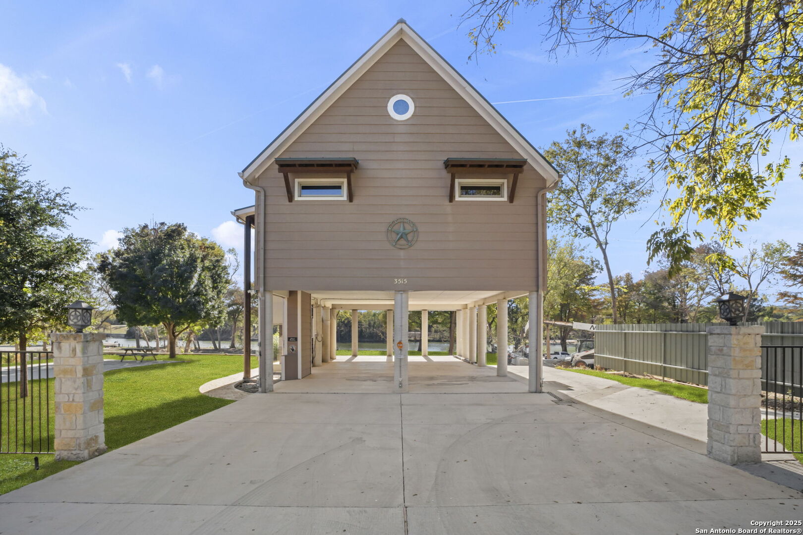 3615 Riverside Drive Kerrville, TX 78028 - Photo 39 of 50 a front view of a house with a yard