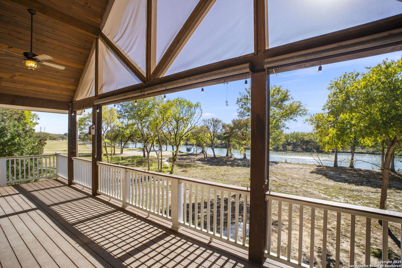 3615 Riverside Drive Kerrville, TX 78028 - Photo 4 of 50 a view of a porch with wooden floor next to a yard
