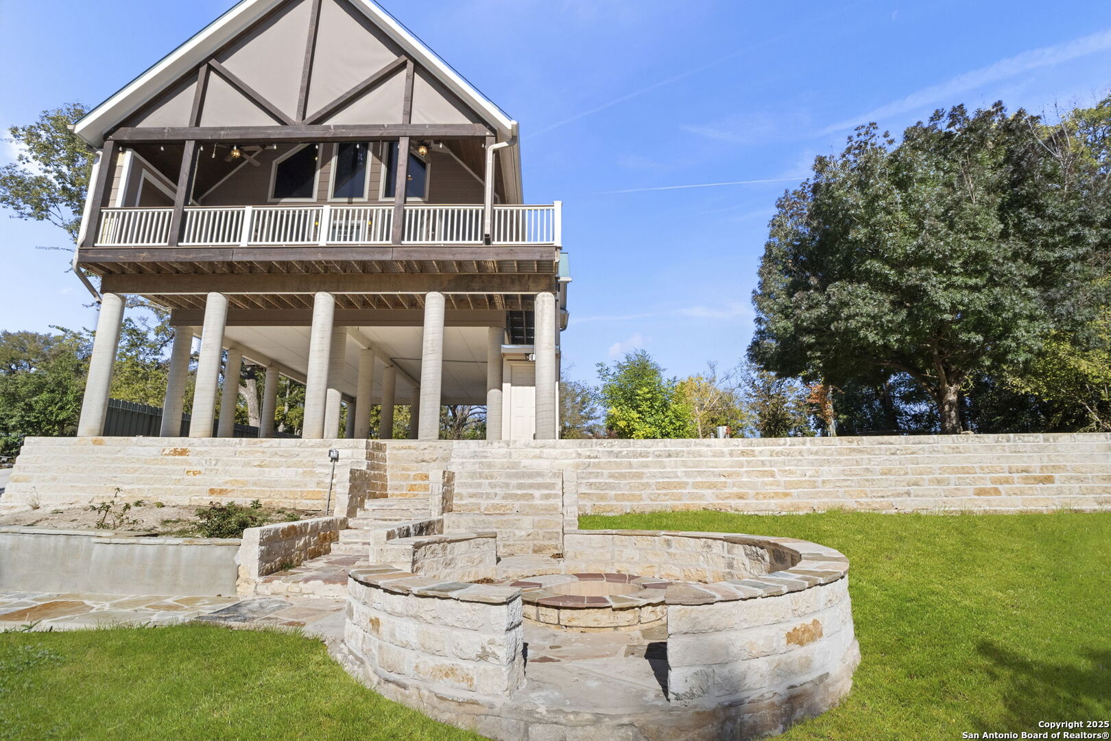 3615 Riverside Drive Kerrville, TX 78028 - Photo 43 of 50 a view of a white house with a swimming pool