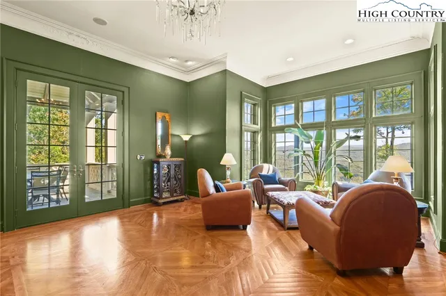a living room with furniture a window and chairs