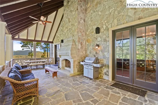 a view of a balcony with furniture