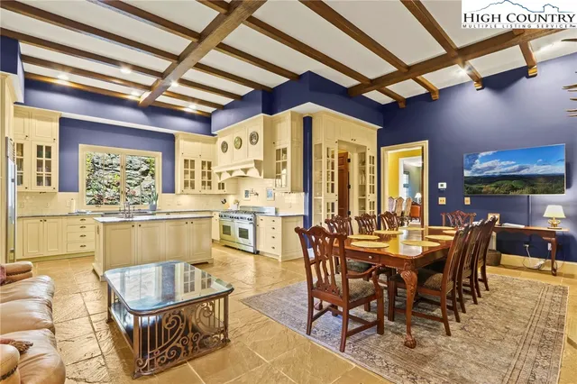 a kitchen with granite countertop a sink and a stove