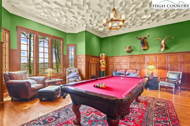 a dining room with furniture and wooden floor