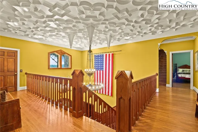 a bedroom with a bed a couch and dresser