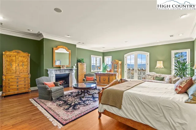 a bedroom with a bed a couch and dresser