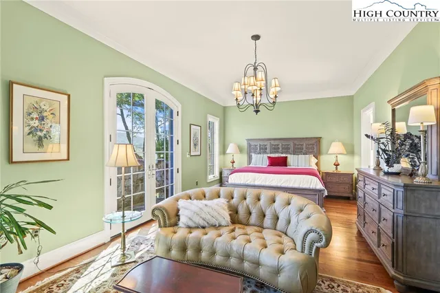 a bed room with two beds and a large window