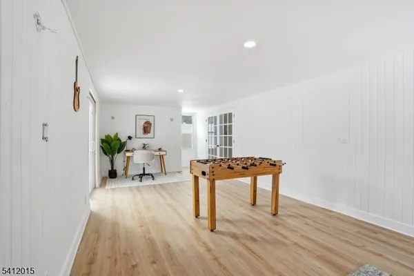 a room with furniture and wooden floor