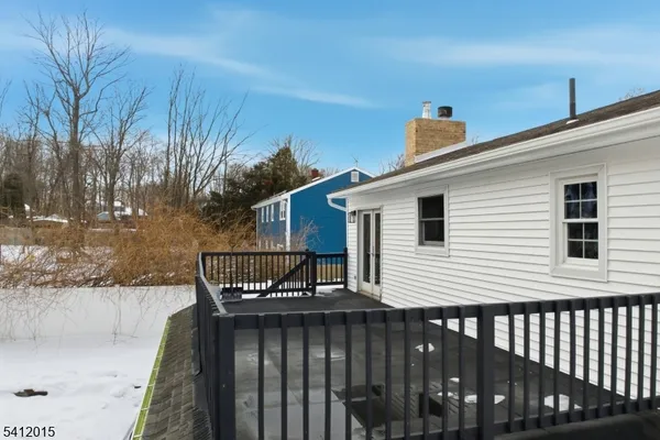 a view of a terrace with wooden fence