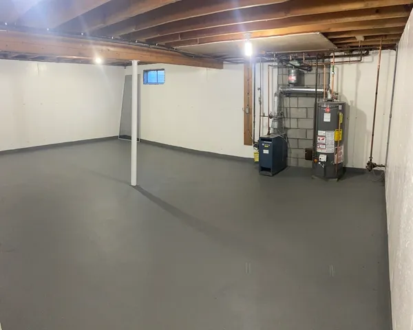 a view of empty room with wooden ceiling