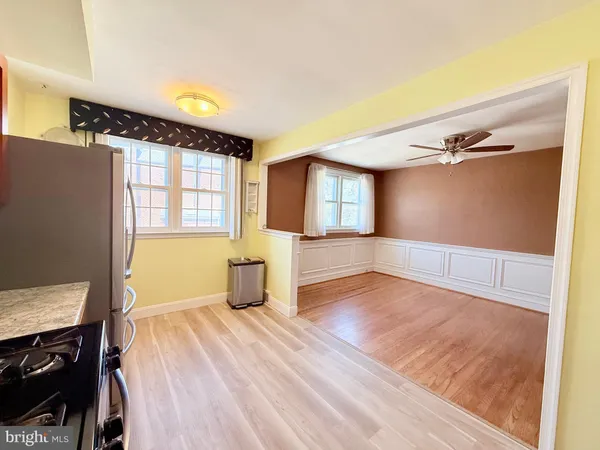 a view of a room with wooden floor and cabinet
