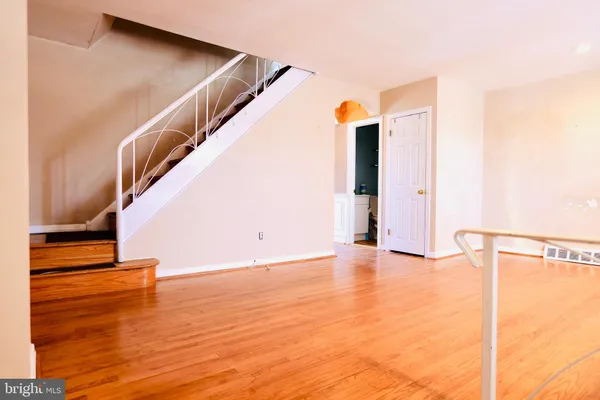 a view of an empty room with stairs