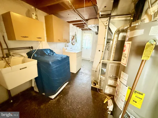 a bath room with a washer and dryer
