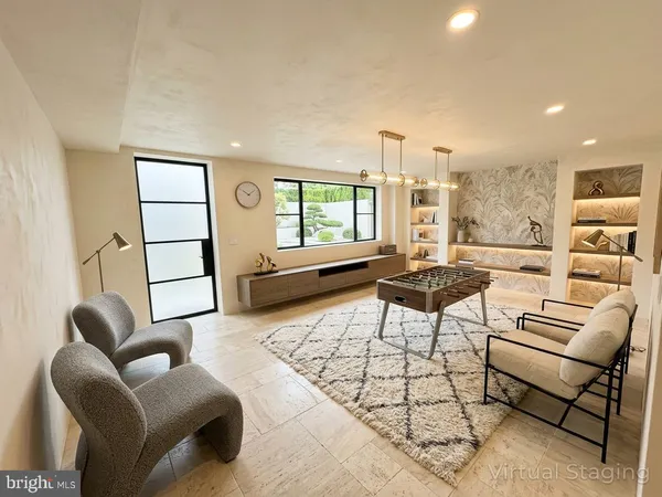 a living room with furniture a rug and a large window