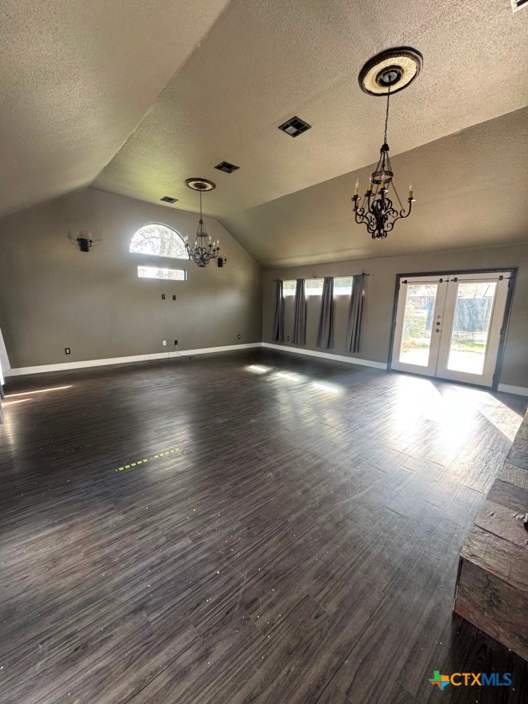 5524 Denmans Mountain Road Belton, TX 76513 - Photo 6 of 15 an empty room with wooden floor and windows