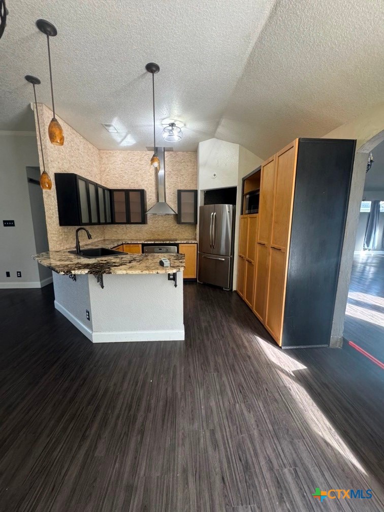 5524 Denmans Mountain Road Belton, TX 76513 - Photo 7 of 15 a view of kitchen with microwave a stove and wooden floor