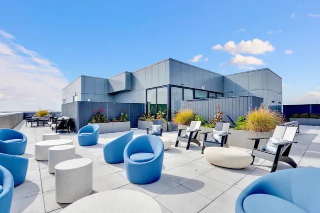 a outdoor living space with furniture and city view