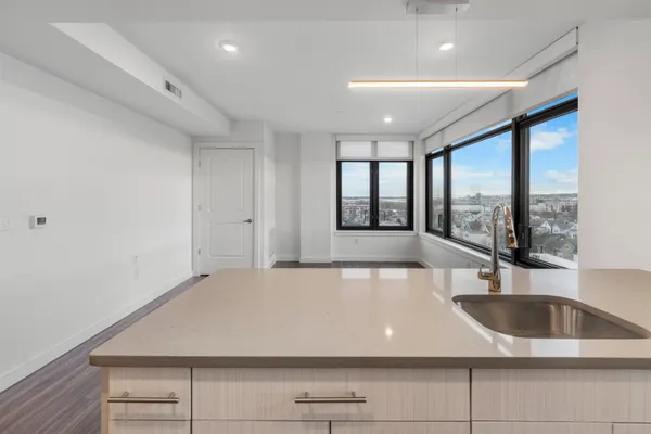 a view of a kitchen with a large window