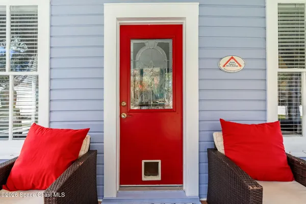 a potted plant sitting on a window sill and a sink