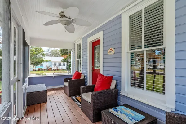 a living room with furniture a dining table and a piano