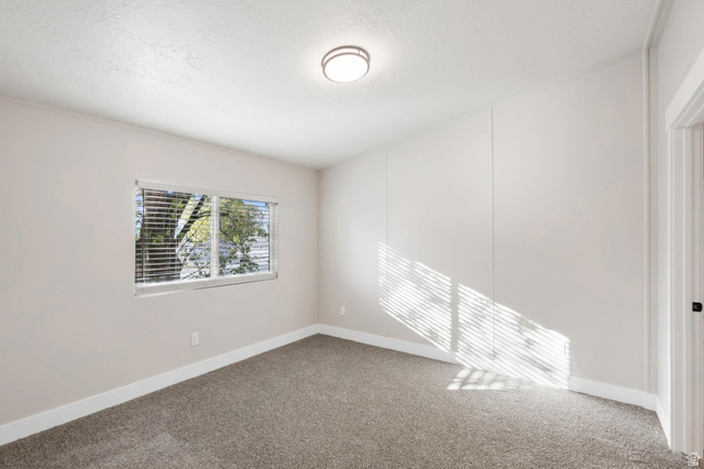 96 Barrington Way Layton, UT 84041 - Photo 7 of 28 Spare room with carpet flooring and baseboards