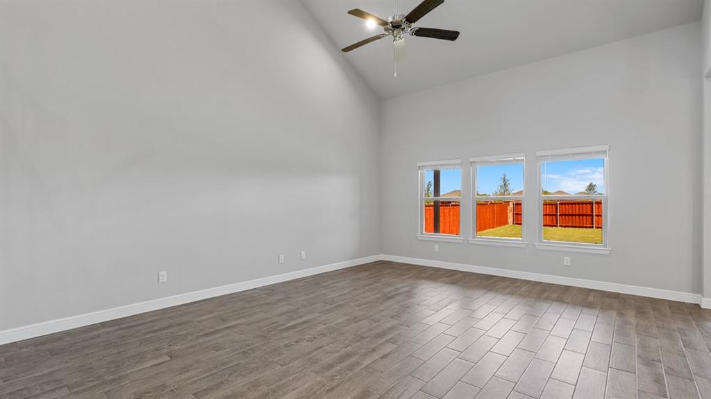 1909 Cookes Lane Cleburne, TX 76033 - Photo 11 of 40 wooden floor in an empty room with a window