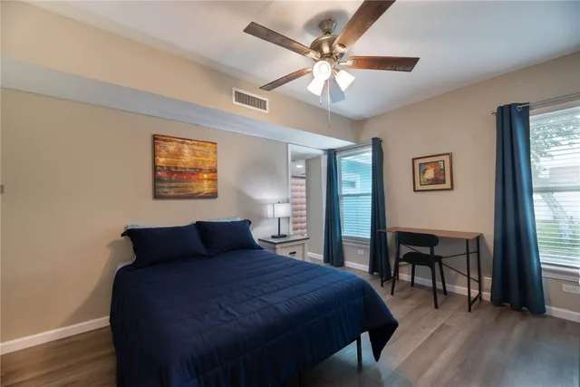 a bedroom with a bed and a table