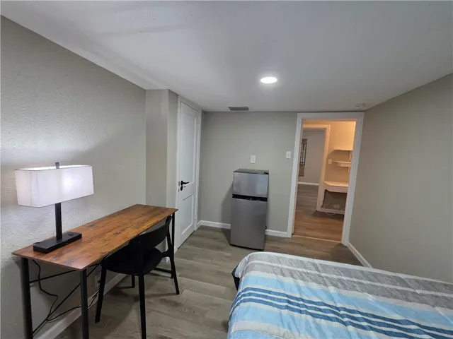 a view of a livingroom with furniture and wooden floor