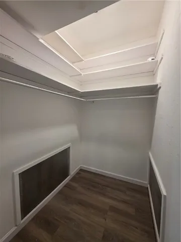 a view of an empty walk in closet