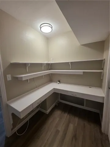 a storage room with wooden floor