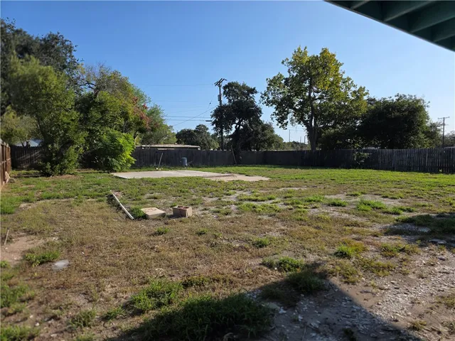 a view of a field with an trees